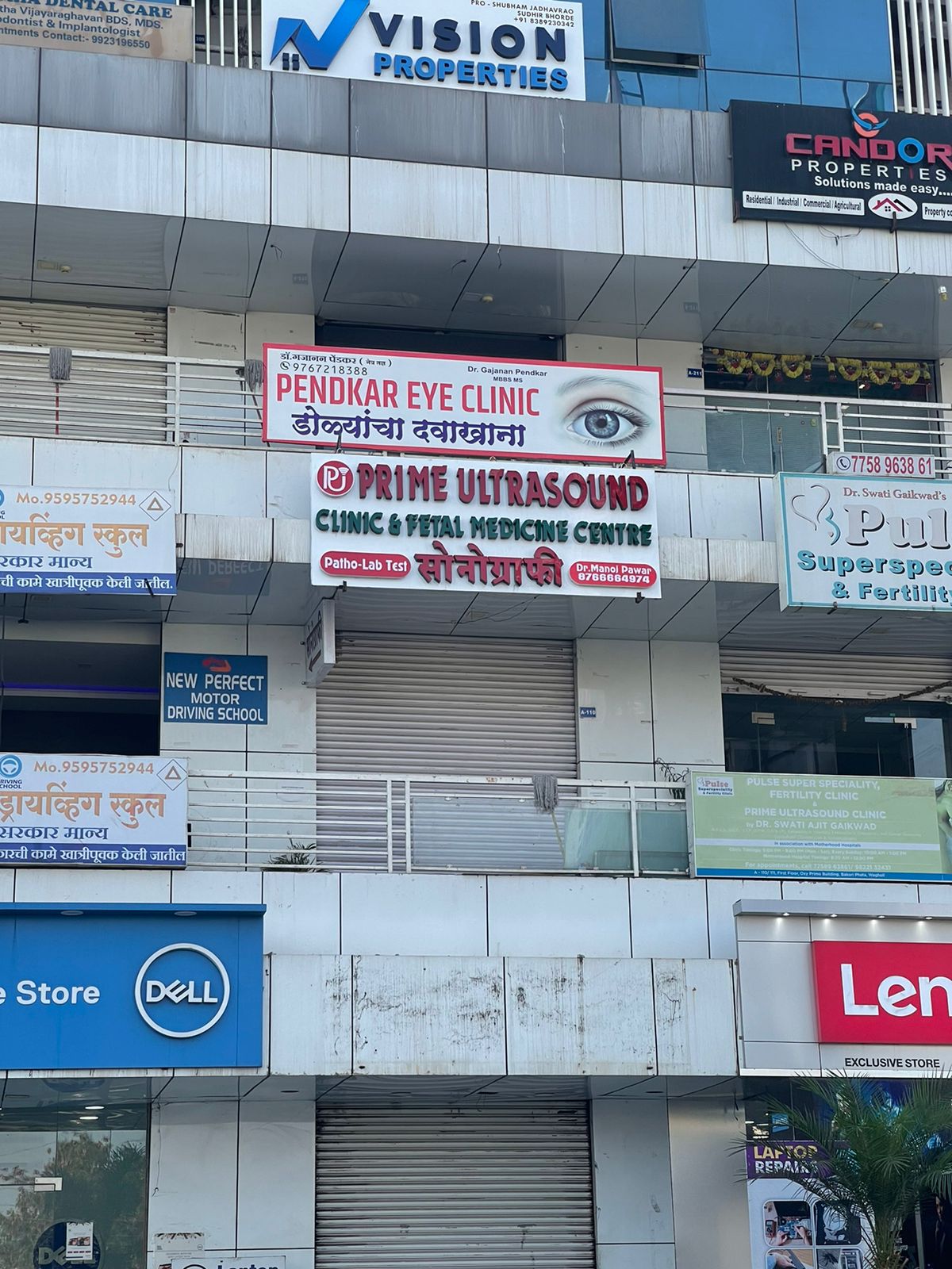 Eye specialist performing eye checkup in clinic